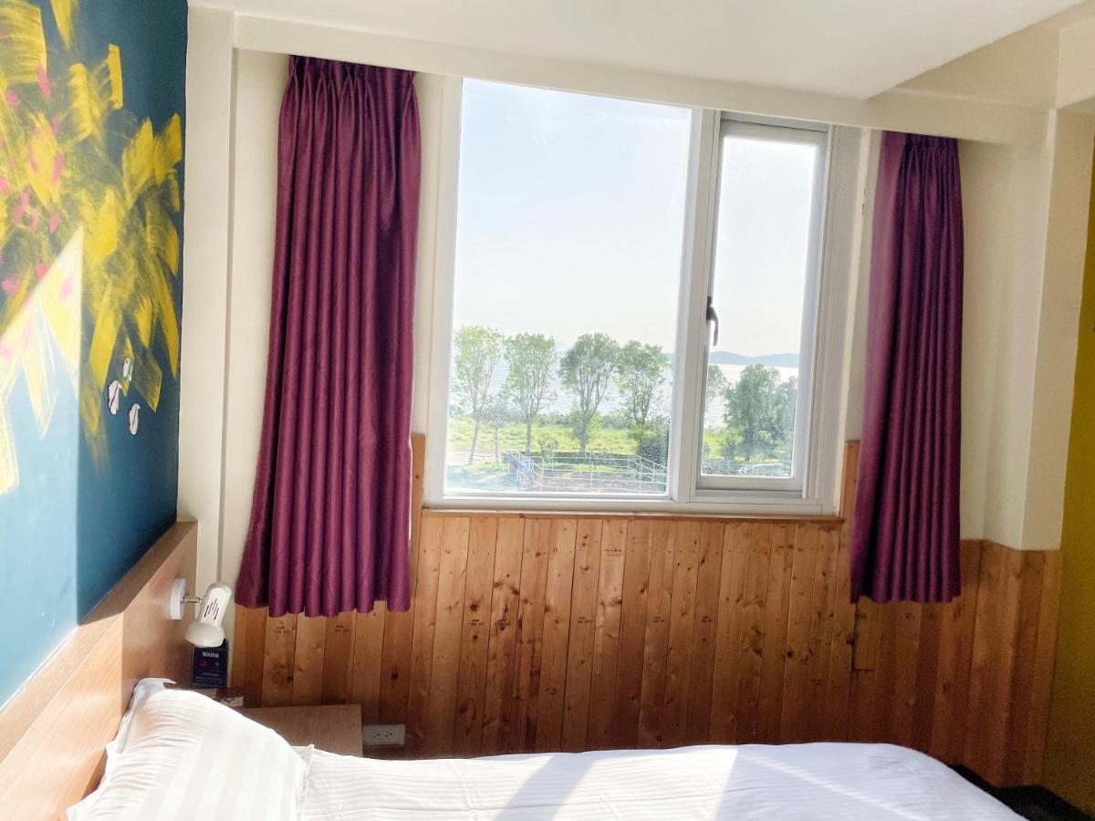 Breeze And Waves Hostel Jinning Esterno foto